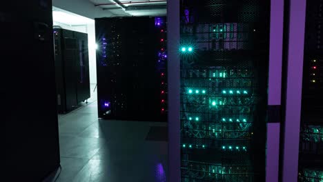 Video-of-empty-corridor-with-rows-of-red-and-green-lights-in-computer-servers