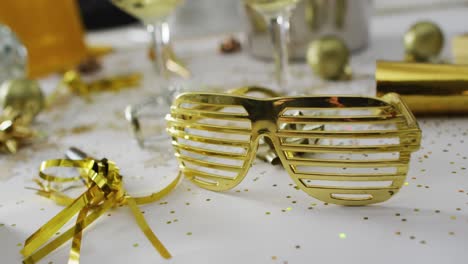 Champagne-glasses-and-decorations-on-white-background-at-new-year's-eve