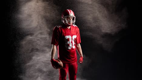Animation-of-american-football-player-holding-ball-over-smoke,-on-black-background