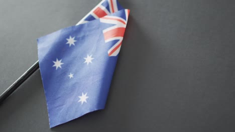 Close-up-of-australian-flag-with-stars-and-stripes-lying-on-gray-background