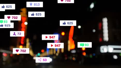 Animation-of-social-media-icons-and-numbers-over-road-traffic-and-cityscape-lights