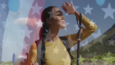 Animation-of-american-flag-over-biracial-woman-looking-away-in-mountains