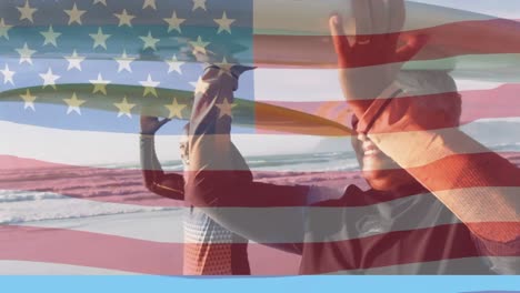 Animation-of-flag-of-united-states-of-america-over-happy-senior-couple-carrying-surfboards-by-sea