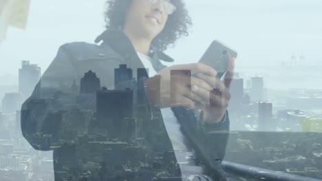 Animation-of-cityscape-over-smiling-biracial-businessman-using-smartphone