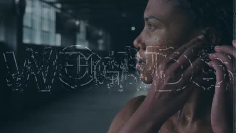 Animation-Eines-Kampftextes-über-Einer-Afroamerikanischen-Sportlerin-Mit-Kopfhörern