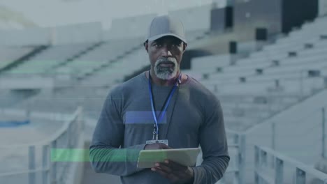 Animation-of-interference-over-african-american-male-coach-with-tablet