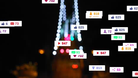 Animation-of-social-media-icons-and-numbers-over-out-of-focus-city-and-traffic-light