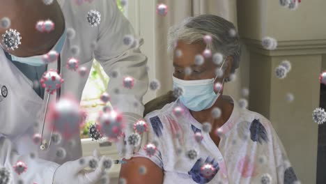Animation-of-covid-19-cells-floating-over-senior-woman-in-face-mask-receiving-vaccination