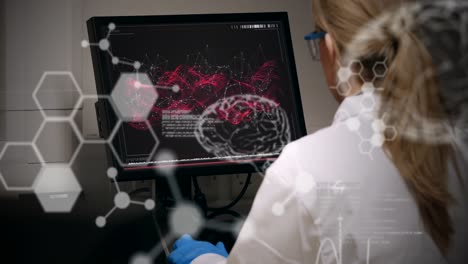 Animation-of-human-brain-spinning-over-female-scientist-using-computer