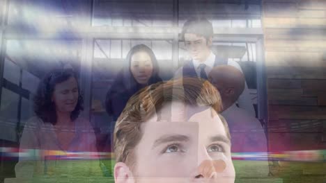 Animation-of-caucasian-man-at-sports-stadium-over-diverse-business-people-using-laptop-in-office