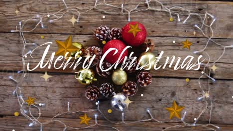 Animation-of-christmas-seasons-greetings-over-fairy-lights-and-decorations-on-wooden-background