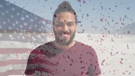 Animation-of-flag-of-united-states-of-america-and-confetti-over-biracial-man-on-beach