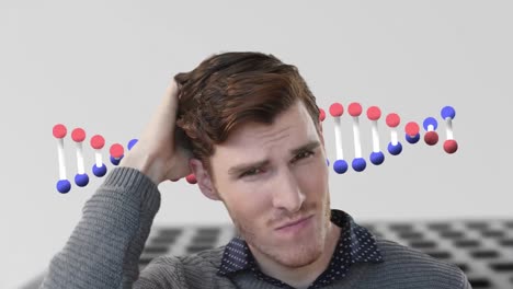 Animation-of-dna-strand-spinning-over-worried-caucasian-businessman