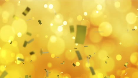 Animation-of-gold-confetti-and-white-and-yellow-bokeh-spots-of-light-spots-on-dark-yellow-background