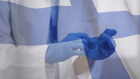 Animation-of-flag-of-finland-with-male-doctor-putting-on-surgical-gloves