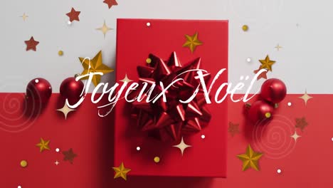 Animation-of-christmas-seasons-greetings-in-french-over-christmas-presents-and-red-bauble-decoration