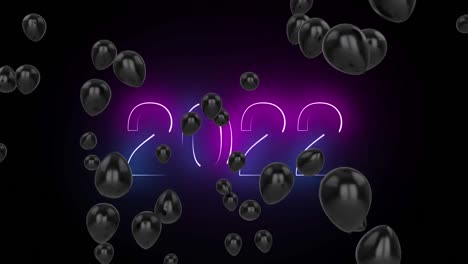 Animation-of-2022-text-in-glowing-blue-and-pink-with-black-balloons-on-black-background