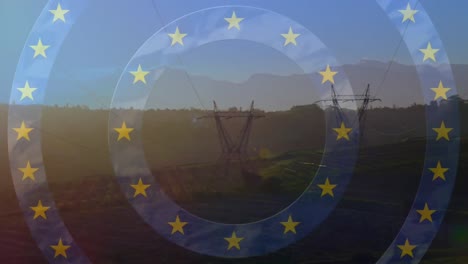 Animation-Von-Sternen-Aus-Der-Flagge-Der-Europäischen-Union-Und-Einer-Karte-über-Strommasten-Im-Feld