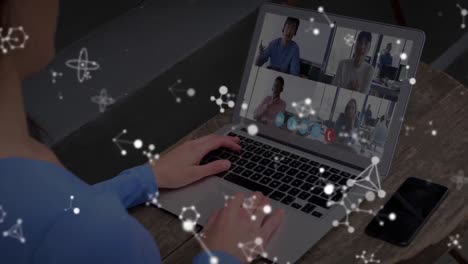 Animation-of-white-molecules-over-woman-on-laptop-video-call