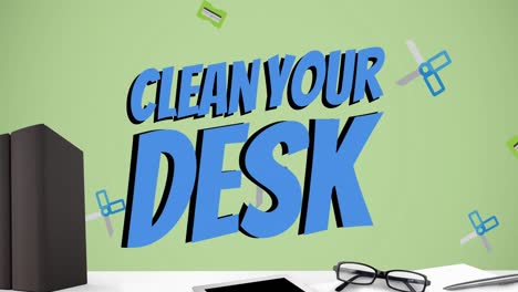 Animation-of-clean-your-desk-text-over-computer-and-office-items-over-green-background