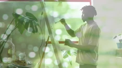 Animation-of-african-american-man-painting-over-light-spots