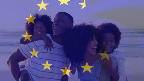 Animation-of-happy-african-american-family-at-beach-over-eu-flag