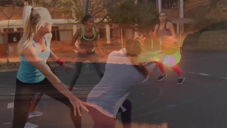 Animation-of-sunset-over-diverse-women-playing-basketball-outdoors