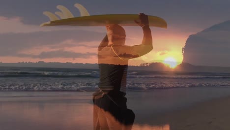 Animation-of-sunset-over-african-american-man-holding-surfing-board-and-walking-on-beach