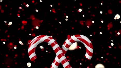 Animation-of-spots-of-lights-and-christmas-candies-on-black-background