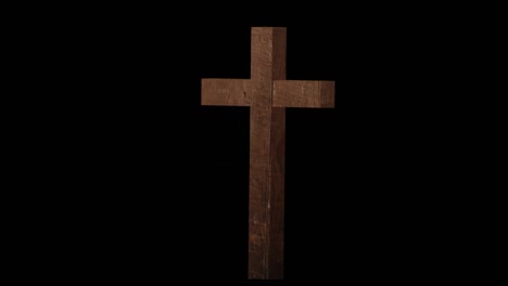 Animation-of-wooden-cross-appearing-on-black-background
