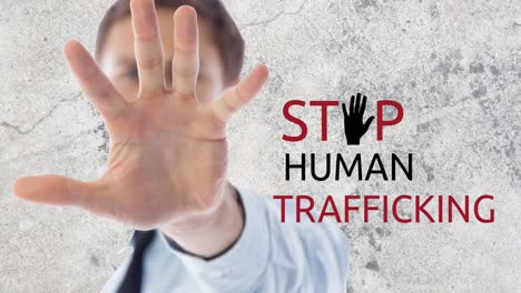Animation-of-stop-human-trafficking-text-over-caucasian-man-with-stop-gesture