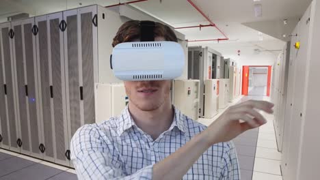 Animation-of-caucasian-businessman-wearing-vr-headset-over-server-room