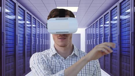 Animation-of-clock-moving-fast-over-businessman-wearing-vr-headset-by-computer-servers-in-tech-room