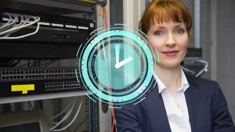 Animation-of-moving-clock-over-caucasian-woman-in-server-room