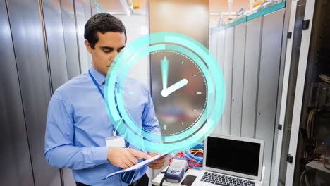 Animation-of-moving-clock-over-biracial-man-in-server-room