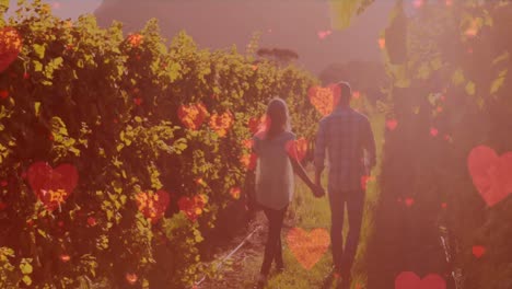 Animation-of-digital-hearts-over-caucasian-couple-walking-on-plantation