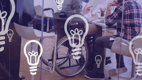 Animation-of-lightbulbs-over-disabled-man-in-wheelchair-discussing-with-his-business-colleague
