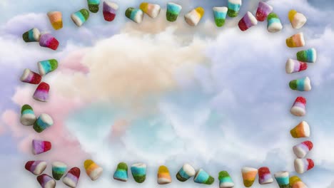 Animation-of-jelly-beans-frame-over-cloudy-sky