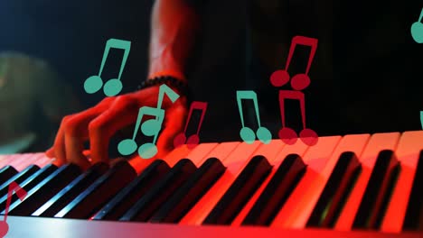 Animation-of-notes-moving-over-caucasian-man-playing-keyboard