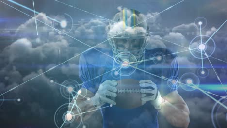 Animation-of-clouds-and-network-of-connections-over-male-american-football-player-with-ball