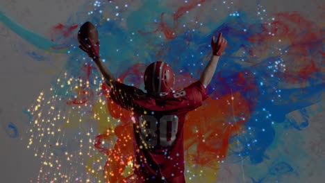 Animation-Eines-Feuerwerks-über-Einem-American-Football-Spieler-Auf-Buntem-Hintergrund