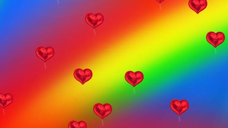 Animation-of-hearts-balloons-on-rainbow-background