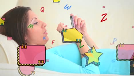 Animation-of-letters-and-shapes-over-caucasian-woman-using-smartphone