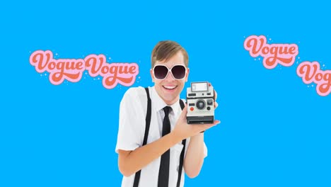 Animation-of-retro-vogue-text-over-male-photographer-with-vintage-camera-on-blue-background