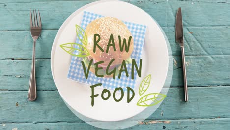 Animation-of-raw-vegan-food-text-over-fresh-hamburger