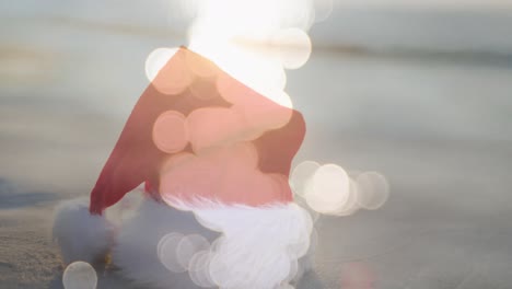 Animation-of-sea-over-christmas-santa-hat