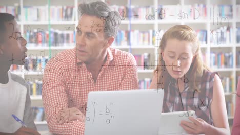 Animation-of-mathematical-equations-over-male-teacher-and-school-children-using-laptop-in-classroom