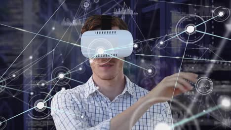 Animation-of-network-of-connection-with-icons-over-man-using-vr-headset