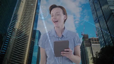 Animation-of-caucasian-businesswoman-using-tablet-and-network-of-connections-over-cityscape