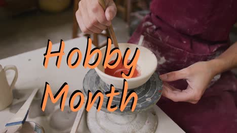 Animation-of-hobby-month-over-woman-in-pottery-workshop